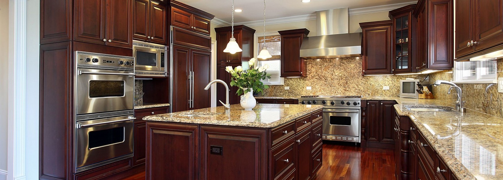 Kitchen with the darker cherry color cabinets